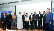 Dignitaries and officials pose for a group picture.