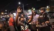 Demonstrators confront police while protesting the acquittal of former St. Louis police officer Jason Stockley in St. Louis, Missouri on September 16, 2017. AFP / Getty Images North America / Scott Olson