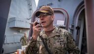 Vice Admiral Scott Stearney, commander of US Naval Forces Central Command, US 5th Fleet and Combined Maritime Forces, speaks on the 1MC shipboard intercom to welcome the crew of the guided-missile destroyer USS Jason Dunham to Manama, Bahrain October 24, 