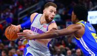 Blake Griffin #23 of the Detroit Pistons drives around Damian Jones #15 of the Golden State Warriors during the second half at Little Caesars Arena on December 01, 2018 in Detroit, Michigan. Gregory Shamus/Getty Images/AFP