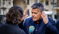 Emile Ratelband, 69, answers journalists' questions on December 3, 2018 in Amsterdam, prior to attend the court's decision regarding his legal bid to slash 20 years off his age.  AFP / ANP / Robin van Lonkhuijsen