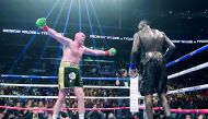 Tyson Fury (L) taunts Deontay Wilder in the ninth round fighting in their WBC Heavyweight Champioinship fight at Staples Center in Los Angeles, on December 1, 2018 AFP / Getty Images North America / Harry How


