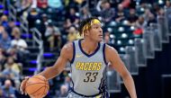 Myles Turner #33 of the Indiana Pacers dribbles the ball against the Chicago Bulls at Bankers Life Fieldhouse on December 4, 2018 in Indianapolis, Indiana. Andy Lyons/Getty Images/AFP