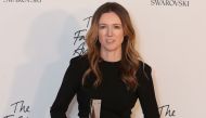 Givency's British fashion designer Clare Waight Keller poses with her award for British designer of the year Womenswear during the British Fashion Awards 2018 in London on December 10, 2018.  AFP / Daniel Leal-Olivas 