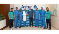  Sean Webber is seen with Dr  Tolessa along with the medical team from Aster Hospital Doha.