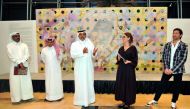 Ali Al Kuwari (centre), President of Qatar Shooting and Archery Federation, with Nadia Chernovil (second right) and Andrii Chernovil (right) at the exhibition. Pic: Abdul Basit / The Peninsula