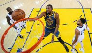 Golden State Warriors forward Kevin Durant (35) shoots the basketball against Memphis Grizzlies guard Garrett Temple (17) and forward Jaren Jackson Jr. (13) during the first half at Oracle Arena. Credit: Kyle Terada-USA TODAY Sports 