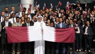 Regency Travel & Tours officials and employees pose for a group photo during Qatar National Day celebrations.  