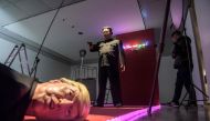 A visitor looks at an art installation by South Korean artist Lim Young-sun entitled 'The Show Must Go On' depicting North Korean leader Kim Jong Un and US president Donald Trump, at the Seoul Art Center on December 19, 2018. AFP / Ed JONES / 