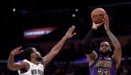 LeBron James #23 of the Los Angeles Lakers scores on a fadeaway jumper over Darius Miller #21 of the New Orleans Pelicans during a 112-104 Laker win at Staples Center on December 21, 2018 in Los Angeles, California. Harry How/AFP