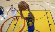 Golden State Warriors forward Kevin Durant (35) dunks the basketball in front of Dallas Mavericks forward Luka Doncic (77) during the first half at Oracle Arena. Kyle Terada