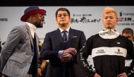 US boxing legend Floyd Mayweather Jr (L) and kickboxer Tenshin Nasukawa of Japan (R) pose on the stage during a weigh-in event at Saitama Super Arena in Saitama on December 30, 2018, on the eve of their exhibition fight. / AFP / Behrouz MEHRI