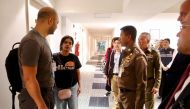 Saudi teen Rahaf Mohammed al-Qunun is greeted by Thai immigration authorities at a hotel inside Suvarnabhumi Airport in Bangkok, Thailand January 7, 2019. Thailand Immigration Police