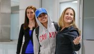 Rahaf Mohammed al-Qunun (C) accompanied by Canadian Minister of Foreign Affairs Chrystia Freeland (R) and Saba Abbas, general counsellor of COSTI refugee service agency, arrives at Toronto Pearson International Airport in Toronto, Ontario, Canada January 