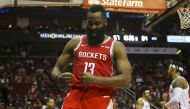 Houston Rockets guard James Harden (13) flexes after scoring on a layup during the third quarter against the Brooklyn Nets at Toyota Center. John Glaser