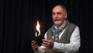 Harold Voit, owner of the Magic Academy in Pullach near Munich, southern Germany, performs on November 29, 2018. / AFP / Christof STACHE 