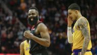 Houston Rockets guard James Harden (13) celebrates and Los Angeles Lakers forward Kyle Kuzma (0) reacts after a play during overtime at Toyota Center. Troy Taormina