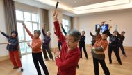 This photo taken on December 5, 2018, shows residents taking a dance class at the Yanyuan community for senior citizens, on the outskirts of Beijing. AFP / GREG BAKER 