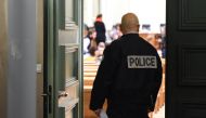 A police officer stands at the entrace of the courtroom in Bordeaux, southwestern France, on January 21, 2019 before the trial of Vincent Leroyer, a former hockey club coach, for sexual abuse and rape on a minor. AFP/Mehdi Fedouach 