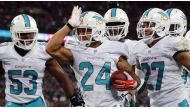 Miami Dolphins' Cortland Finnegan celebrates a touchdown against the Oakland Raiders during an  NFL football game at Wembley Stadium in London September 28,  2014. Reuters