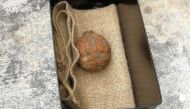 This handout photograph taken on February 2, 2019, and released February 3 by the Hong Kong Police Force shows World War I-era German hand grenade that was found among a shipment of French potatoes bound for a potato chips factory, in Hong Kong. 