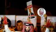 A demonstrator wearing a mask of Saudi Crown Prince Mohammed bin Salman attends a protest outside the Saudi consulate in Istanbul, October 25, 2018. Reuters / Osman Orsal