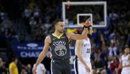 Golden State Warriors guard Stephen Curry (30) reacts after a Warriors basket against the San Antonio Spurs in the third quarter at Oracle Arena. Cary Edmondson