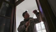 This file photo taken on January 31, 2019 shows carpenter Ma Jiale working in an old building in Shanghai. Peter Stebbings and Lan Lianchao / AFP / STR 