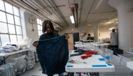 Fabscrap Operations Coordinator Sabina Montinar sorts fabric on February 1, 2019, at the company's warehouse in New York. AFP / Don Emmert 