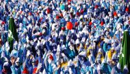 Participants dressed as smurfs celebrate after setting a new record for the world's largest meeting of smurfs in Lauchringen, Germany February 16, 2019. REUTERS/Arnd Wiegmann