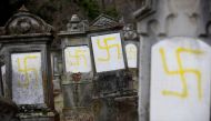 Graves that were desecrated with swastikas are seen at the Jewish cemetery in Quatzenheim near Strasbourg, France, February 19, 2019. Reuters/Vincent Kessler