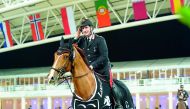 Italian rider Emanuele Gaudiano celebrates his victory astride Chalou on the opening day of the Longines Global Champions Tour - Doha event at the Al Shaqab Arena, yesterday. 
