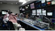  An employee works with trainees at SBC, a new channel under the umbrella of the Saudi Broadcasting Corporation in Riyadh, on April 24, 2018. AFP 