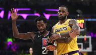 LeBron James #23 of the Los Angeles Lakers pushes Landry Shamet #20 of the Los Angeles Clippers during the second half of a game at Staples Center on March 04, 2019 in Los Angeles, California. 
