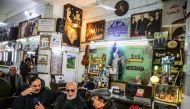 Iraqi men gather and socialise at Umm Kulthum Cafe on Rasheed street, the oldest street in the capital Baghdad on January 20, 2019. AFP / Sabah Arar