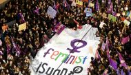 Demonstrators hold a banner and placards during a rally marking the International Women's Day on Istiklal avenue, in Istanbul on March 8, 2019.  AFP / Yasin Akgul
 