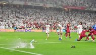 FILE PHOTO: Fans throw bottles and flip-flops at the pitch during the 2019 AFC Asian Cup semi-final football match between Qatar and UAE at the Mohammed Bin Zayed Stadium in Abu Dhabi on January 29, 2019. / AFP / Giuseppe CACACE