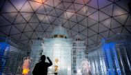 A tourist visits a Tatra Ice Temple at Hrebienok, High Tatras mountains resort in eastern Slovakia on February 27, 2019. AFP / Vladimir Simicek