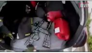 An image taken from a social media apparently taken by a gunman and posted online live as the attack unfolded, shows him retrieving weapons from the boot of his car in Christchurch, New Zealand, March 15, 2019