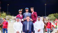  The Medium Tour podium winners pose for a photograph with officials during the opening day of the 10th Round of Hathab Series, yesterday.