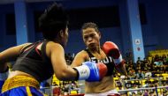 Huang Wensi fights against Thailand's Jarusiri Rongmuang for the Asia Female Continental Super Flyweight Championship gold belt in Taipei, Taiwan, September 26, 2018. Reuters/Yue Wu 