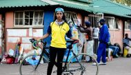 Maria Kgatitsoe, the only female cyclist to ride to Durban in South Africa with the Stokvel group, strikes a pose in the town of Ladysmith. Handout picture courtesy of: Lesego Button Konupi