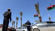 Libyan traffic police direct cars during an operation at the Martyrs Square in the Libyan capital Tripoli, on March 12, 2019.  AFP / Mahmud Turkia 