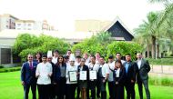 Officials and employees of The Westin Doha Hotel and Spa posing for a group picture with the awards.