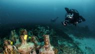 This undated handout photo released on April 9, 2019 shows divers exploring the ruins of an ancient shipwreck on the Aegean island of Alonissos, Greece.  AFP / Ephorate of Underwater Antiquities 