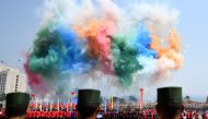 Day fireworks go off during a military parade, to commemorate 30 years of a ceasefire signed with the Myanmar military in the Wa State, in Panghsang on April 17, 2019. AFP / Ye Aung Thu
 