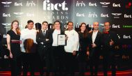 The employees of the STK Doha with the award.