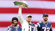 Former New England Patriots player Rob Gronkowski raises the Lombardi Trophy over his head before the Red Sox home opening game against the Toronto Blue Jays at Fenway Park in Boston, Massachusetts, on April 09, 2019. AFP / Getty Images North America / Ma