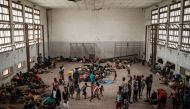 People of Buzi take shelter in the Samora M Machel secondary school, used as an evacuation center in Beira, Mozambique, on March 21, 2019 following the Cyclone Idai. AFP/Yasuyoshi Chiba