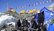 Sherpas sit at the Mount Everest base camp,  April 2014. Reuters / Phurba Tenjing Sherpa